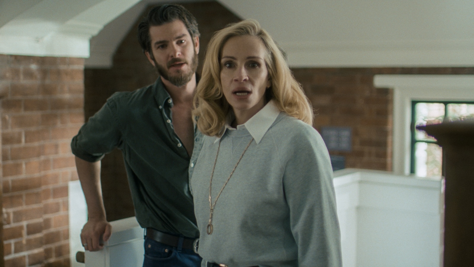 AFTER THE HUNT (2025) Julia Roberts and Andrew Garfield looking shocked.