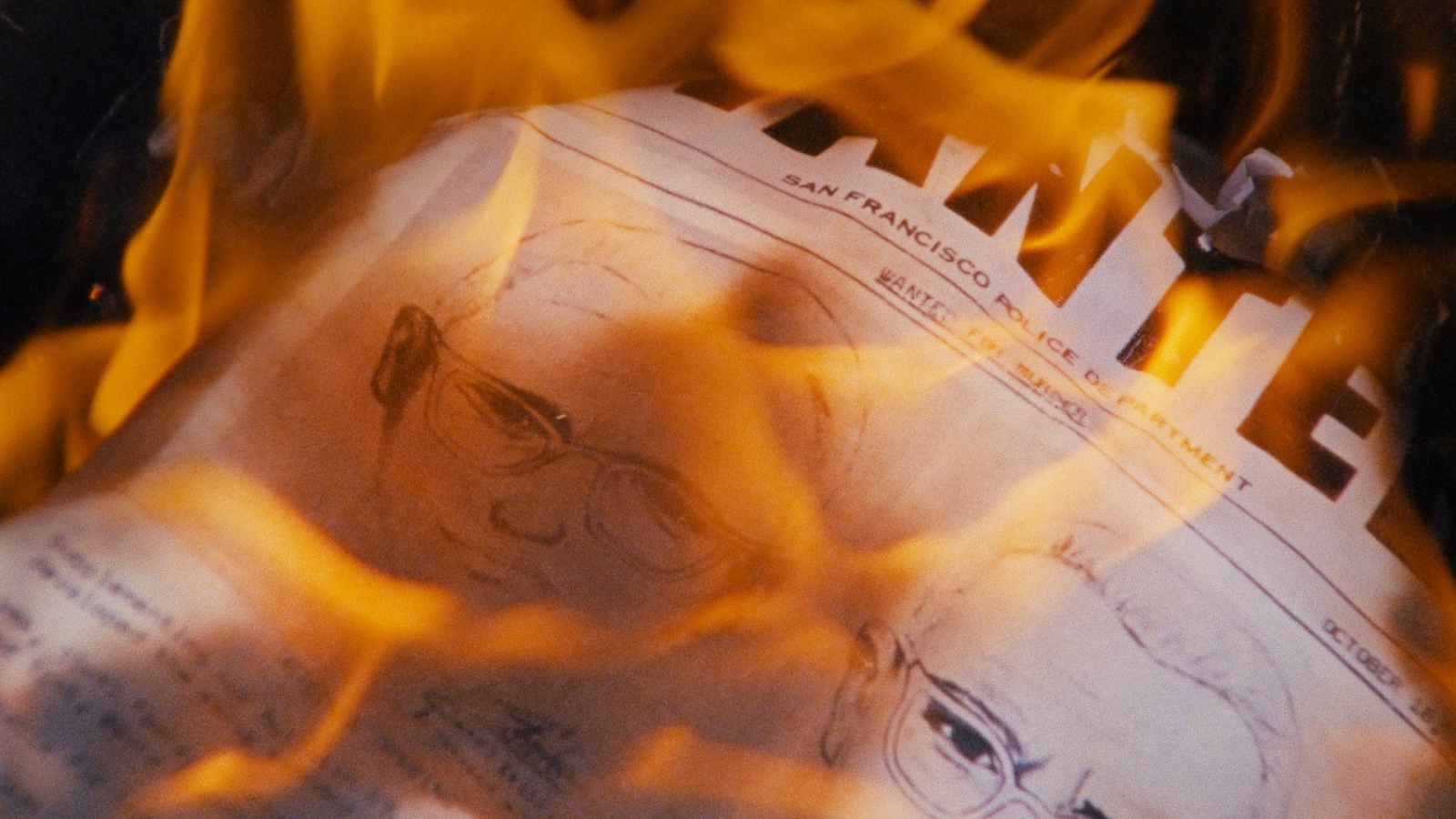 A newspaper featuring an illustration of the suspected Zodiac killer consumed by flames.