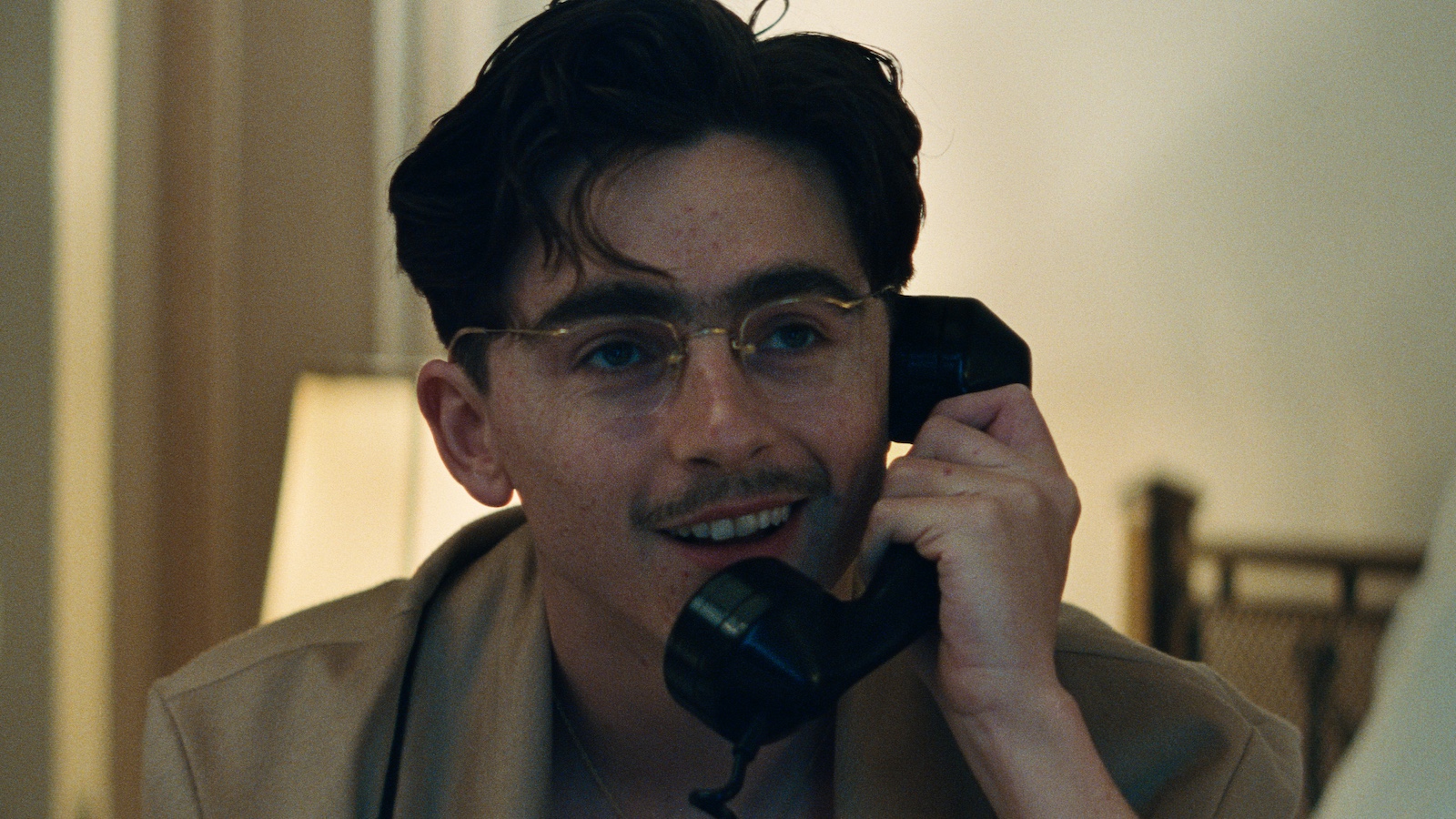 A group of people sit in the back of a van looking worried, including a woman in a wedding dress
