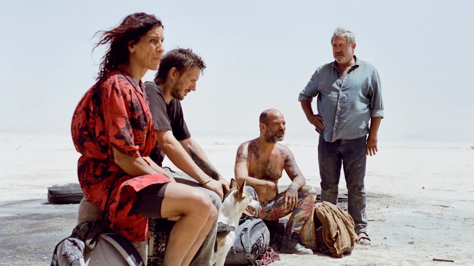A young woman stands in a lake, getting ready to jump in.