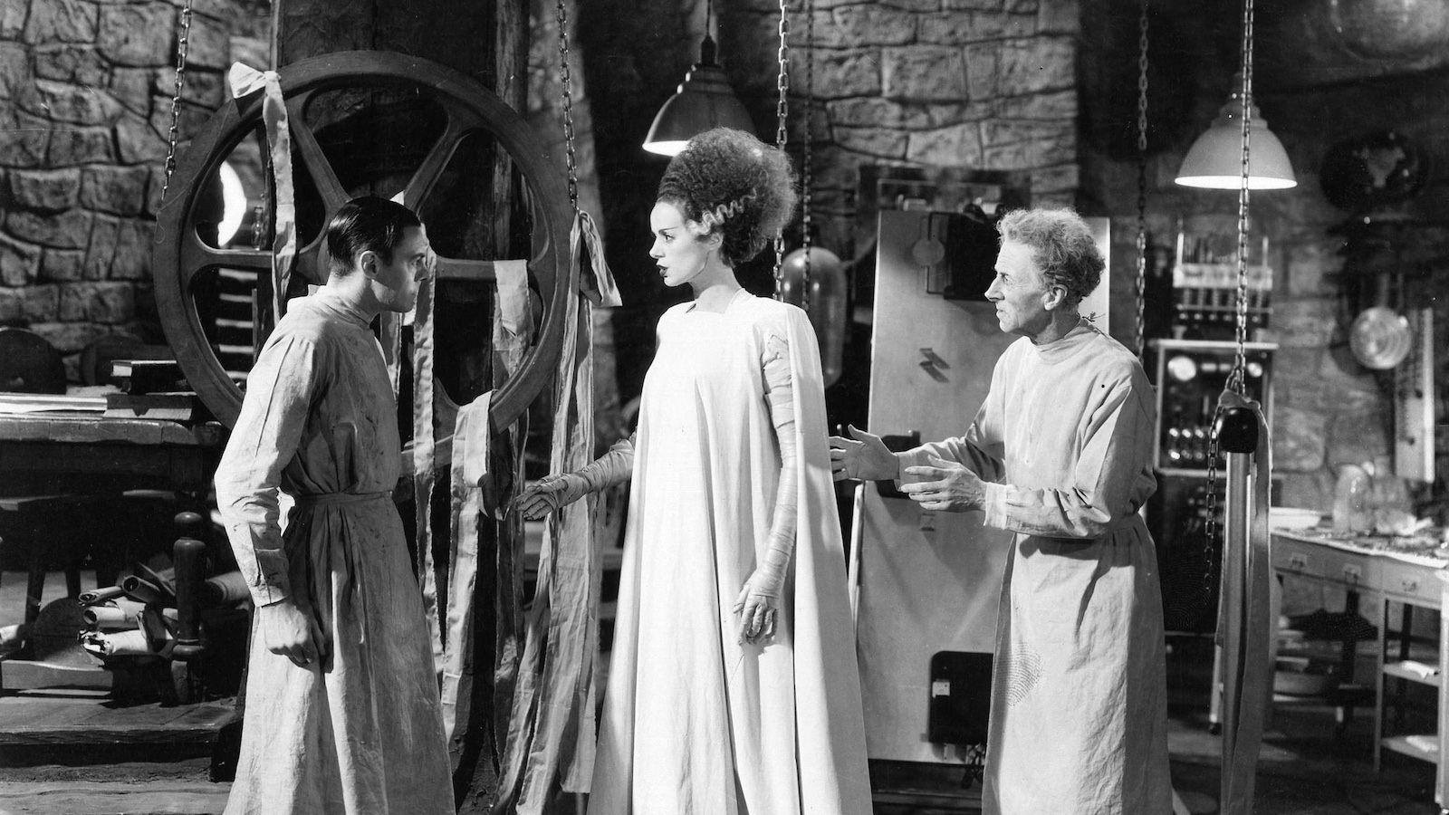 Black and white image of a man in a suit overlaid with textured psychedelic imagery.